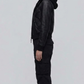 Side angle profile view highlighting the matte black heavy hardware zipper and snug elastic ribbed cuffs of the Y2K style outerwear.