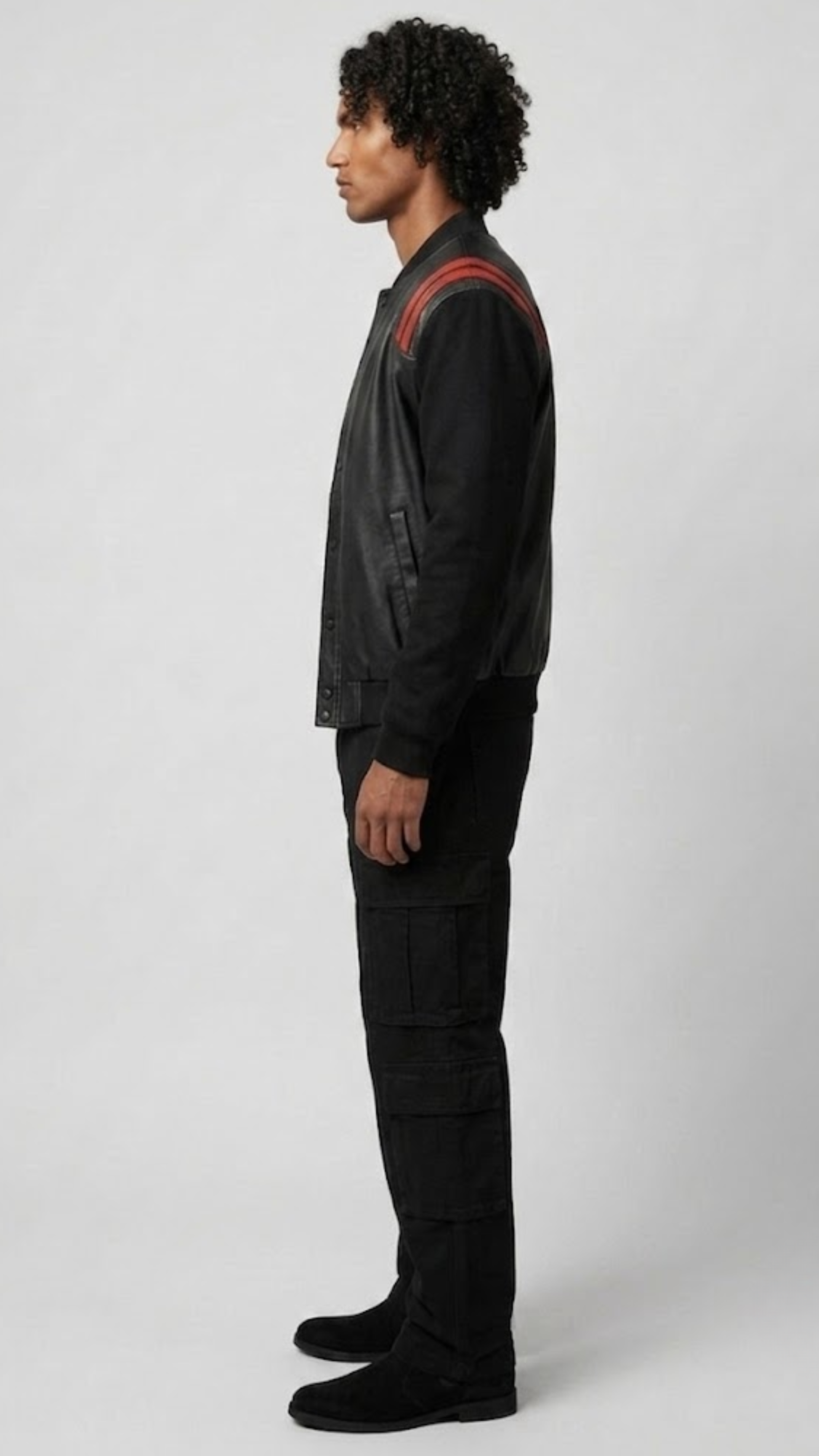 Detailed view of the athletic striped black and red rib-knit collar, cuffs, and waistband on a high-quality leather casual jacket.