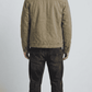 Tailored fit olive green cotton outerwear with white fur details styled beautifully for an urban smart-casual look.