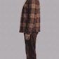 Tailored fit checked flannel winter outerwear styled effortlessly over a hoodie for a modern urban streetwear look.