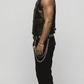 Versatile black leather button up vest layered elegantly over a white dress shirt, perfect for a high-end modern aesthetic.