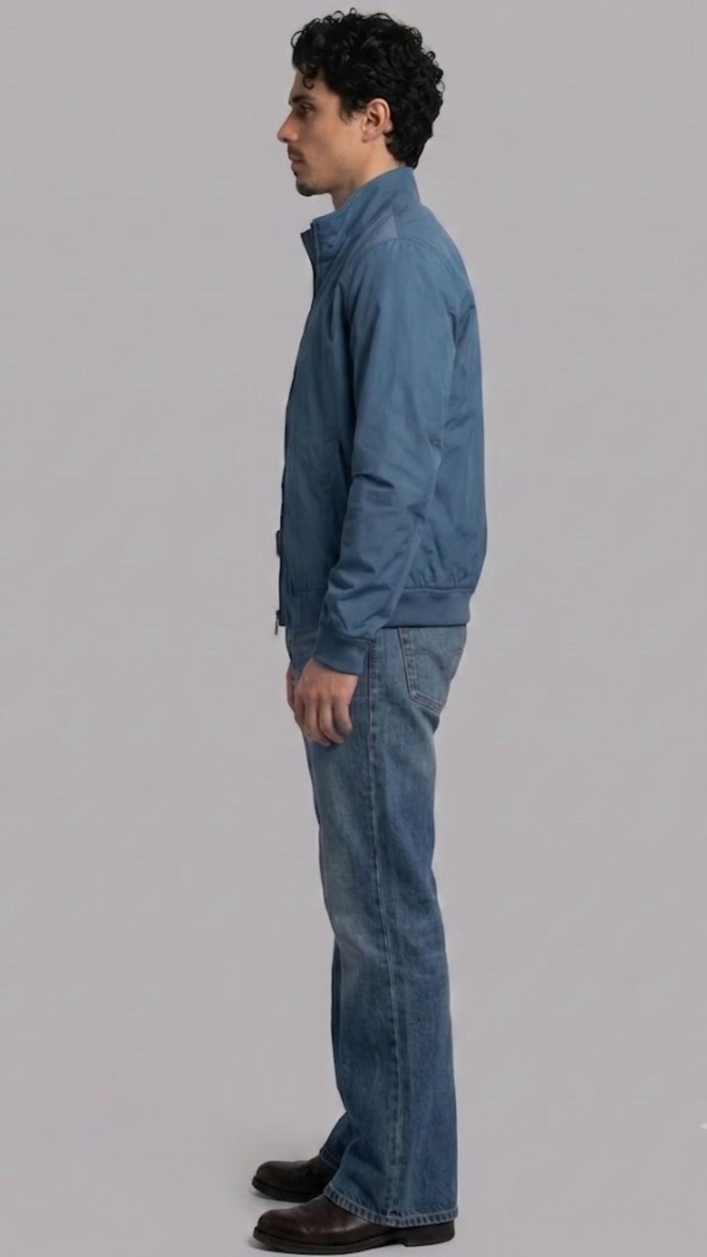 Regular fit men's vibrant teal blue bomber jacket displaying clean side pockets and a comfortable, modern outerwear profile.