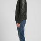 Versatile black leather jacket layered beautifully over a casual hoodie, perfect for an edgy urban streetwear aesthetic.