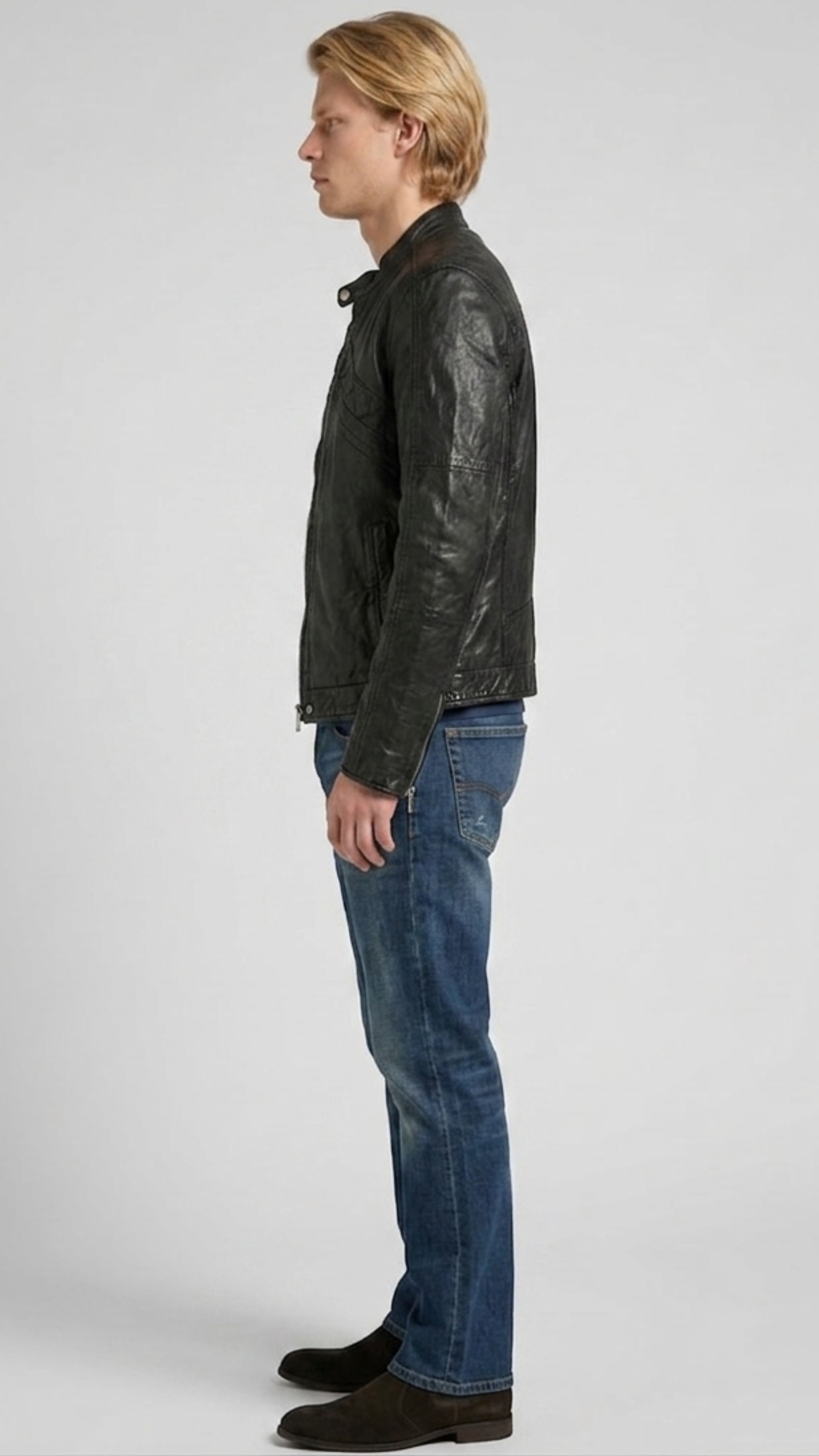 Versatile black leather jacket layered beautifully over a casual hoodie, perfect for an edgy urban streetwear aesthetic.