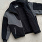 Detailed view of soft-touch interior lining and plush textured colorblocked wool fleece material.