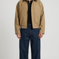 Premium beige leather jacket featuring a contrast dark brown leather collar and zip closure