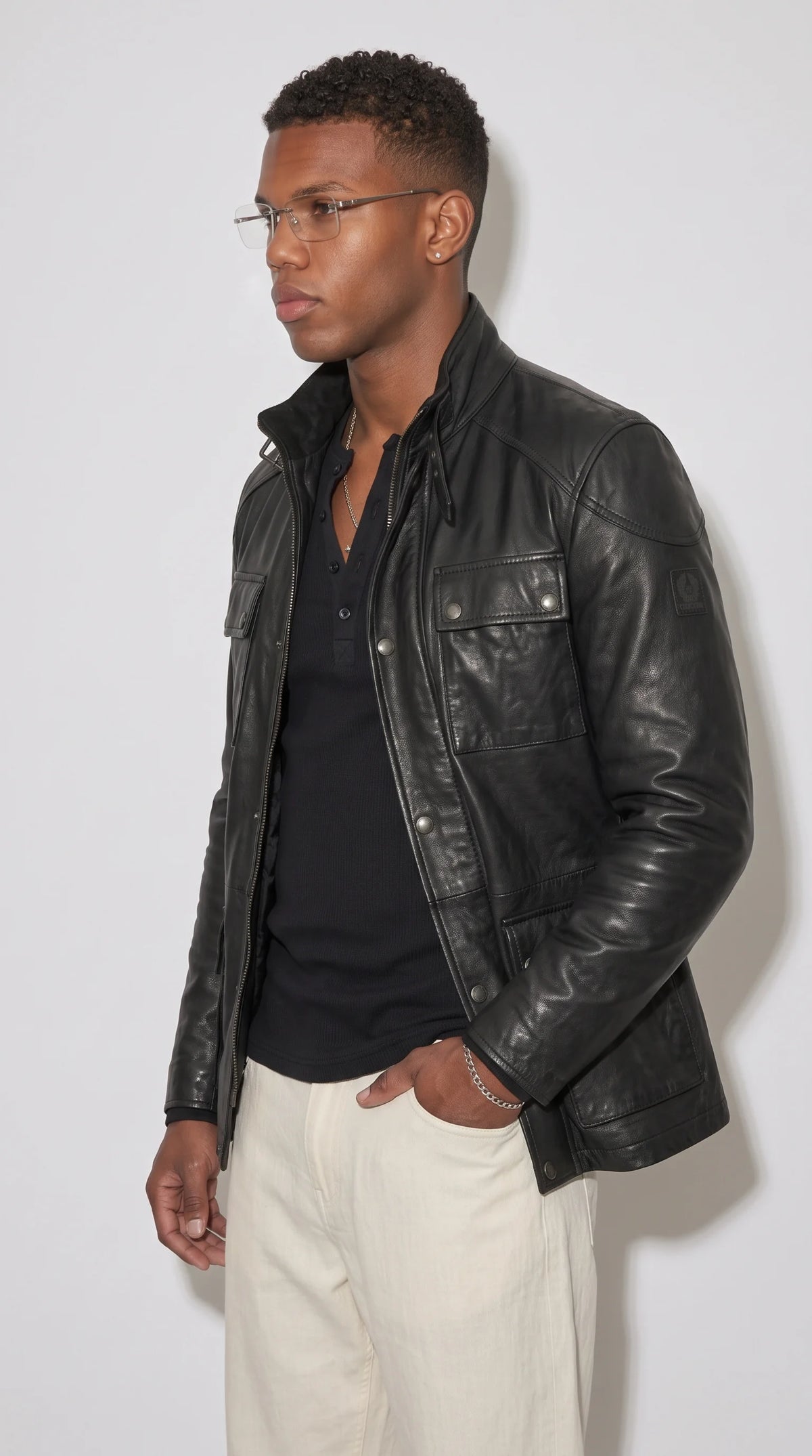 JACKERO black leather cargo field jacket showcasing two button-flap chest pockets and two lower waist pockets, with a balanced heritage silhouette and functional detailing for a rugged everyday outfit inspired by classic outdoor and utility fashion.