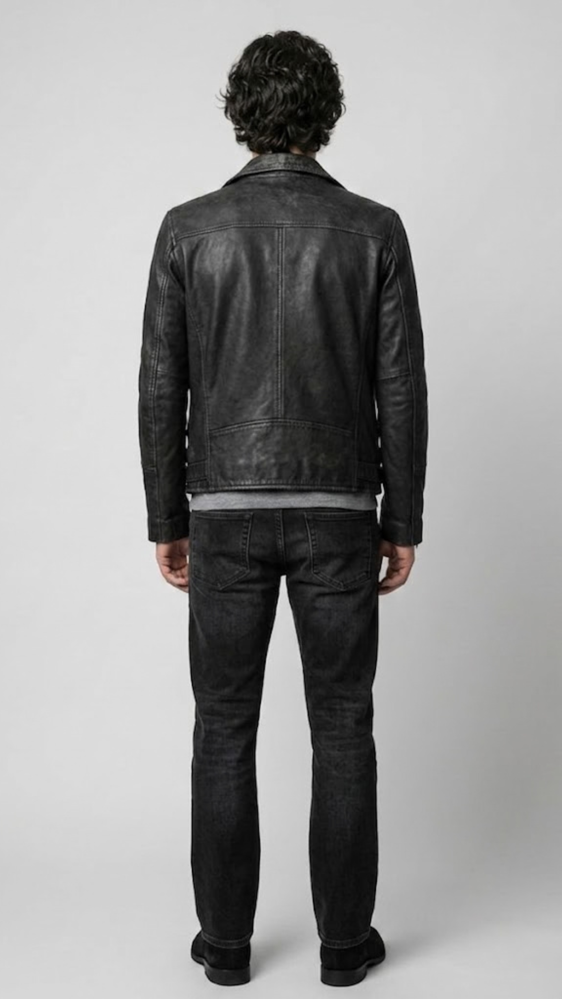 Symmetrical rear view studio shot highlighting the broad shoulder architecture and clean matte finish of the noir leather motorcycle coat.