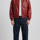 Vibrant red leather bomber jacket shown from the front view in a clean studio setting.
