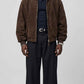 a mens wearing a JACKERO dark chocolate brown suede jacket featuring an oversized baggy fit and clean front zipper.