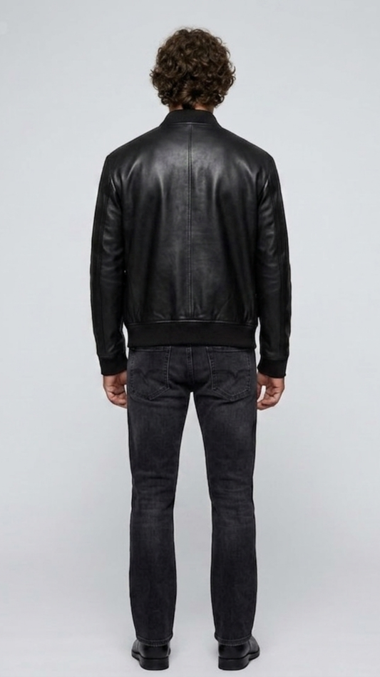 Symmetrical rear view studio shot highlighting the uniform tailoring and smooth premium leather panels of the sleek black flight coat.