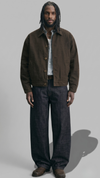 dark brown cotton canvas jacket with distinct collar detailing against a neutral studio background