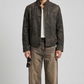 a minimalist charcoal leather jacket with sleek zippers and clean collar