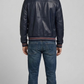 Symmetrical rear view studio shot highlighting the minimalist back panels and deep navy hue of the luxury leather flight coat.