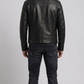 Straight-on back view of a structured black leather motorcycle jacket highlighting its tailored panelling and clean shoulder lines.