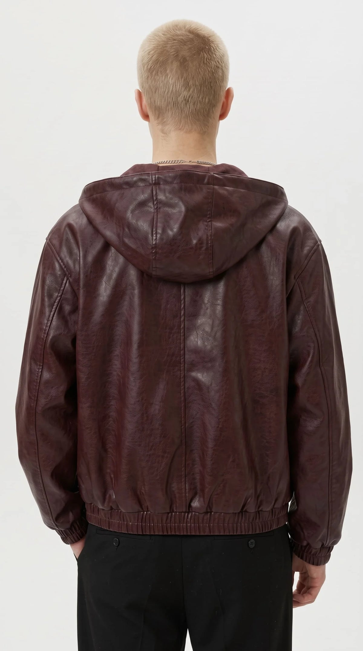 Vintage wine red hooded leather bomber jacket for men with distressed finish, front view on model