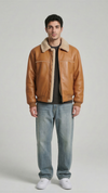 Front view of Jackero men's light tan leather jacket with premium cream shearling collar and inner lining.