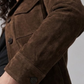 Relaxed mid-length women's suede coat with clean seam detailing and button closure.
