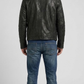 Regular fit men's black leather jacket displaying functional zippered chest pockets and a clean, comfortable profile.