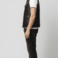 Versatile black leather sleeveless jacket designed for an edgy urban streetwear look and smart-casual winter layering.