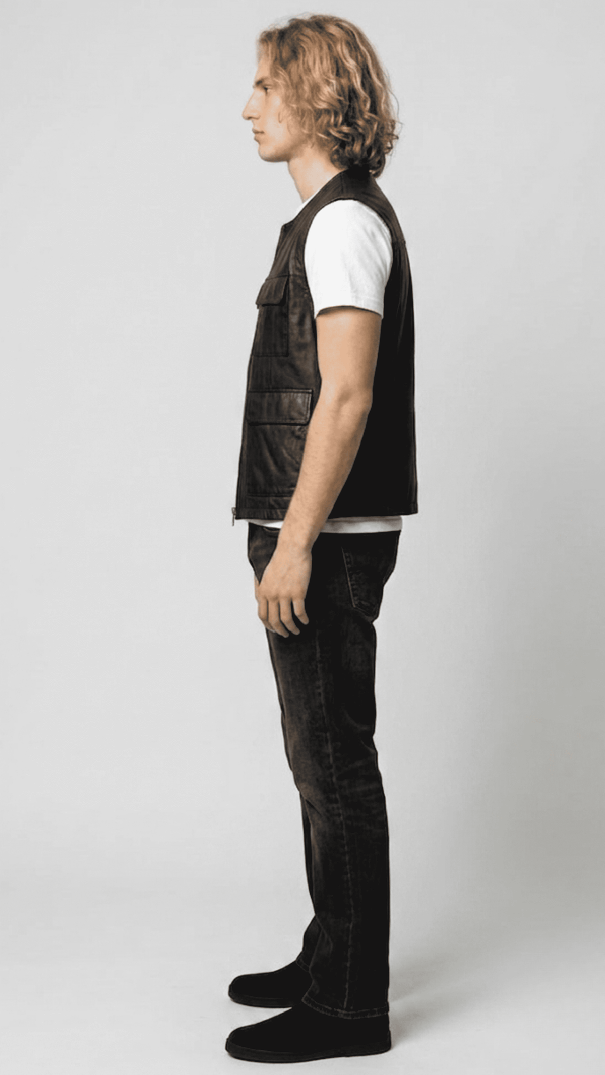 Versatile black leather sleeveless jacket designed for an edgy urban streetwear look and smart-casual winter layering.