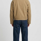Minimalist beige leather outerwear with dark brown leather collar detailing flat lay view
