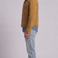 Versatile camel color suede jacket layered over a basic black t-shirt, perfect for a high-end urban streetwear outfit.