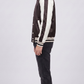 Detailed view of the athletic striped black and white rib-knit collar, waistband, and cuffs on a premium varsity bomber.