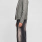 Side-angle profile view of a JACKERO regular fit ash grey leather jacket displaying a structured waistline and comfortable sleeve alignment.
