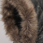 Close-up of a fur-lined hood on a dark jacket against a light background