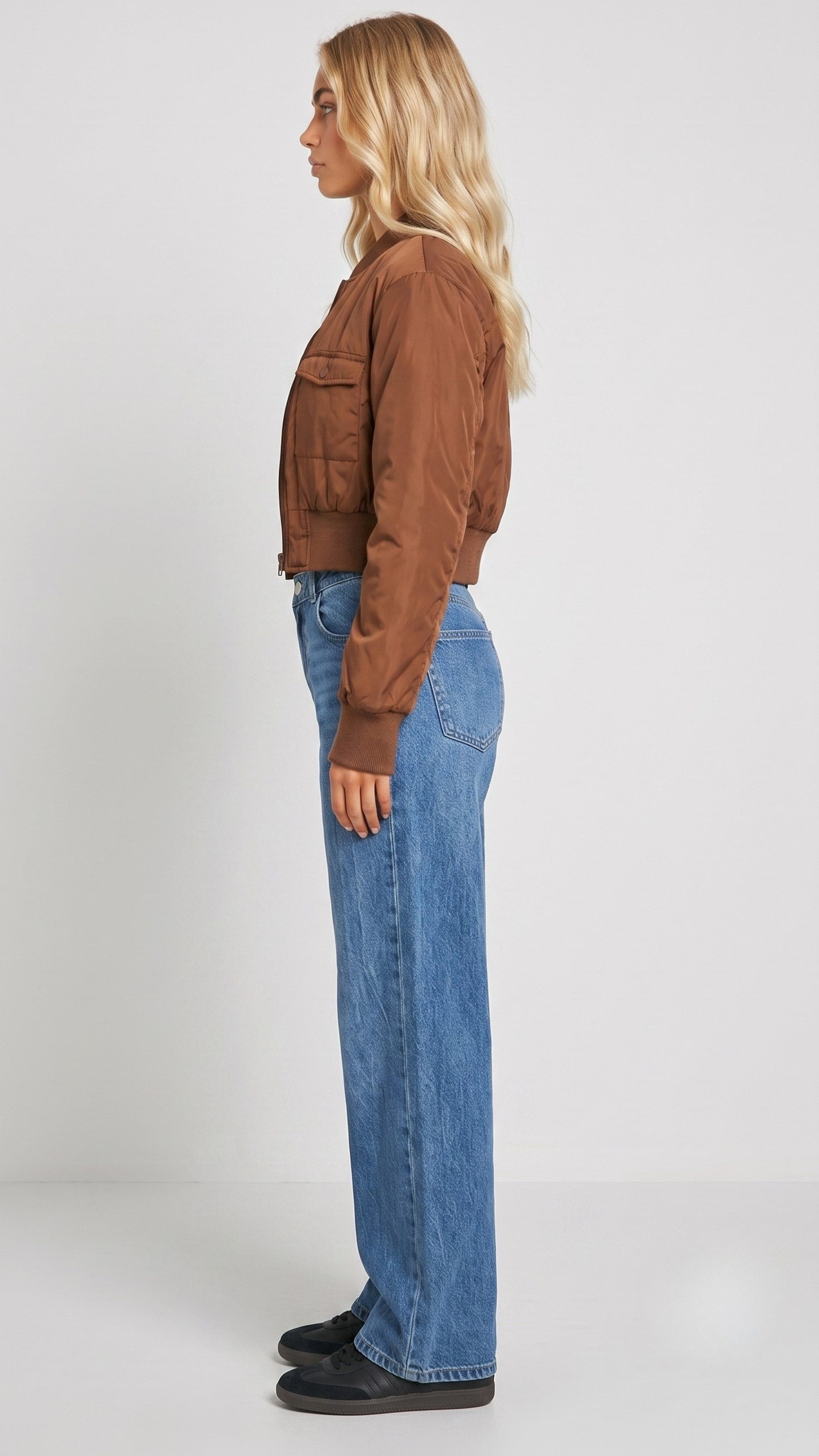 Detailed view of the structured neat collar stitching and smooth shoulder drape on a premium light brown casual jacket.