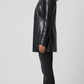 Detailed view of the adjustable leather waist belt and deep functional side pockets on a premium black leather trench coat.