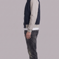 Comfortable and durable navy blue and grey cotton jacket with functional pockets, perfect for everyday wear.