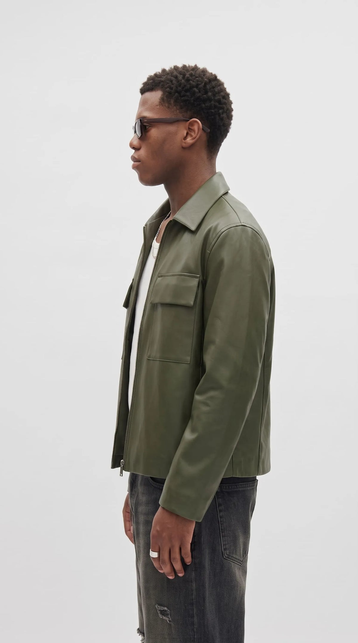 Olive utility leather overshirt jacket for men with military-inspired flap pockets and front zip closure