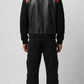 Regular fit men's two-tone leather bomber jacket displaying clean side pockets and a comfortable, streamlined athletic profile.