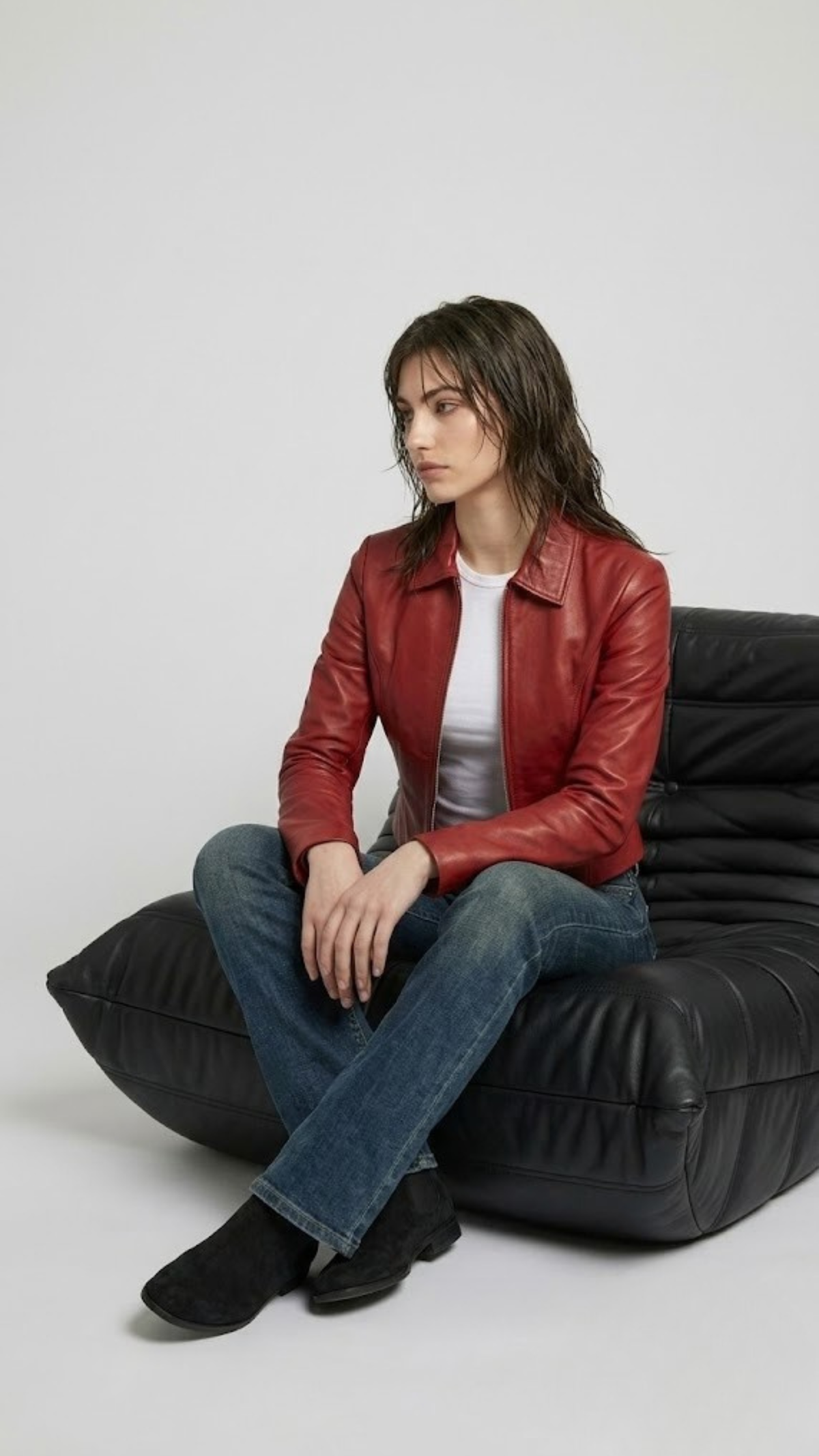 Bold urban streetwear fashion concept featuring a striking red leather racer jacket styled for a contemporary lifestyle aesthetic.