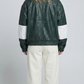 Straight-on back view showcasing the relaxed, oversized fit and clean tailoring of a dark green leather racer jacket.