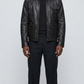 A professional studio front shot of the Jackero premium black leather jacket, showcasing its clean, unblemished texture and minimalist zip-up front.