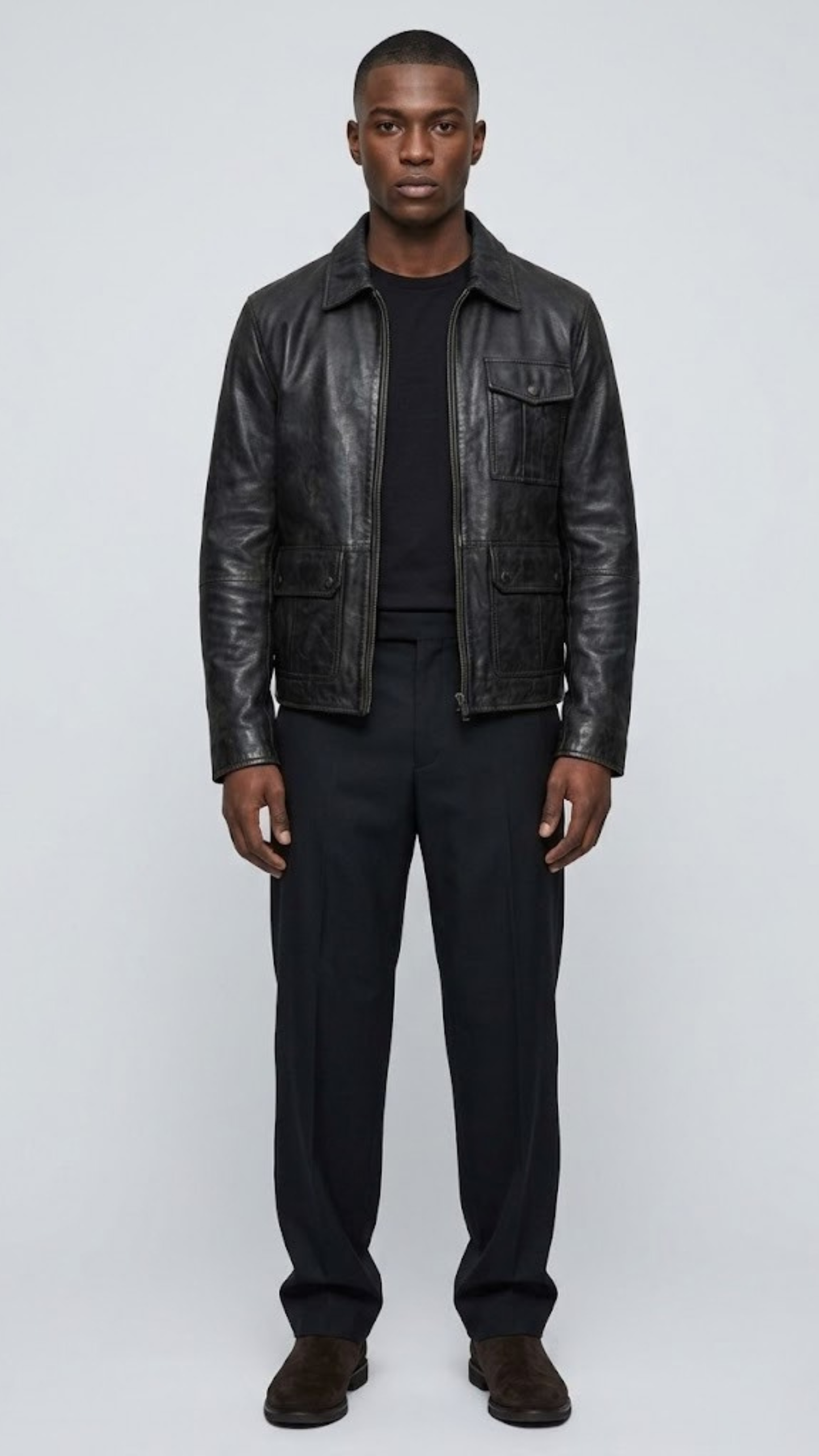 A professional studio front shot of the Jackero premium black leather jacket, showcasing its clean, unblemished texture and minimalist zip-up front.