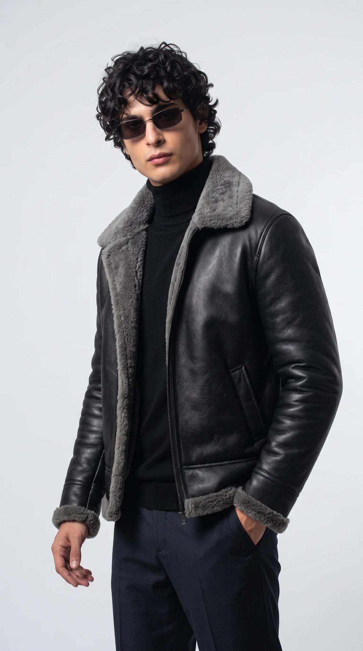 Channel ultimate rebel energy with the Jackero black leather jacket, featuring a plush grey shearling collar that perfectly balances hardcore biker aesthetics with premium winter comfort.