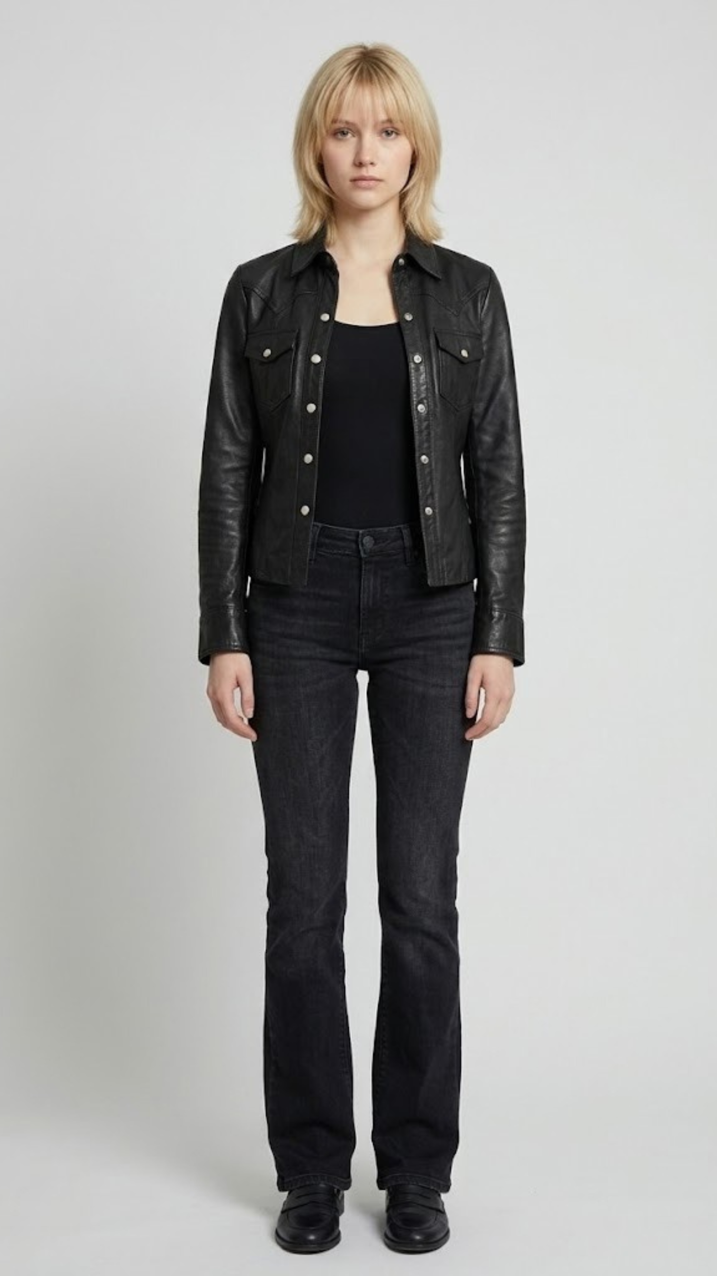 A professional studio front shot of the Jackero premium black leather trucker jacket, highlighting its polished leather finish and classic button-up layout.