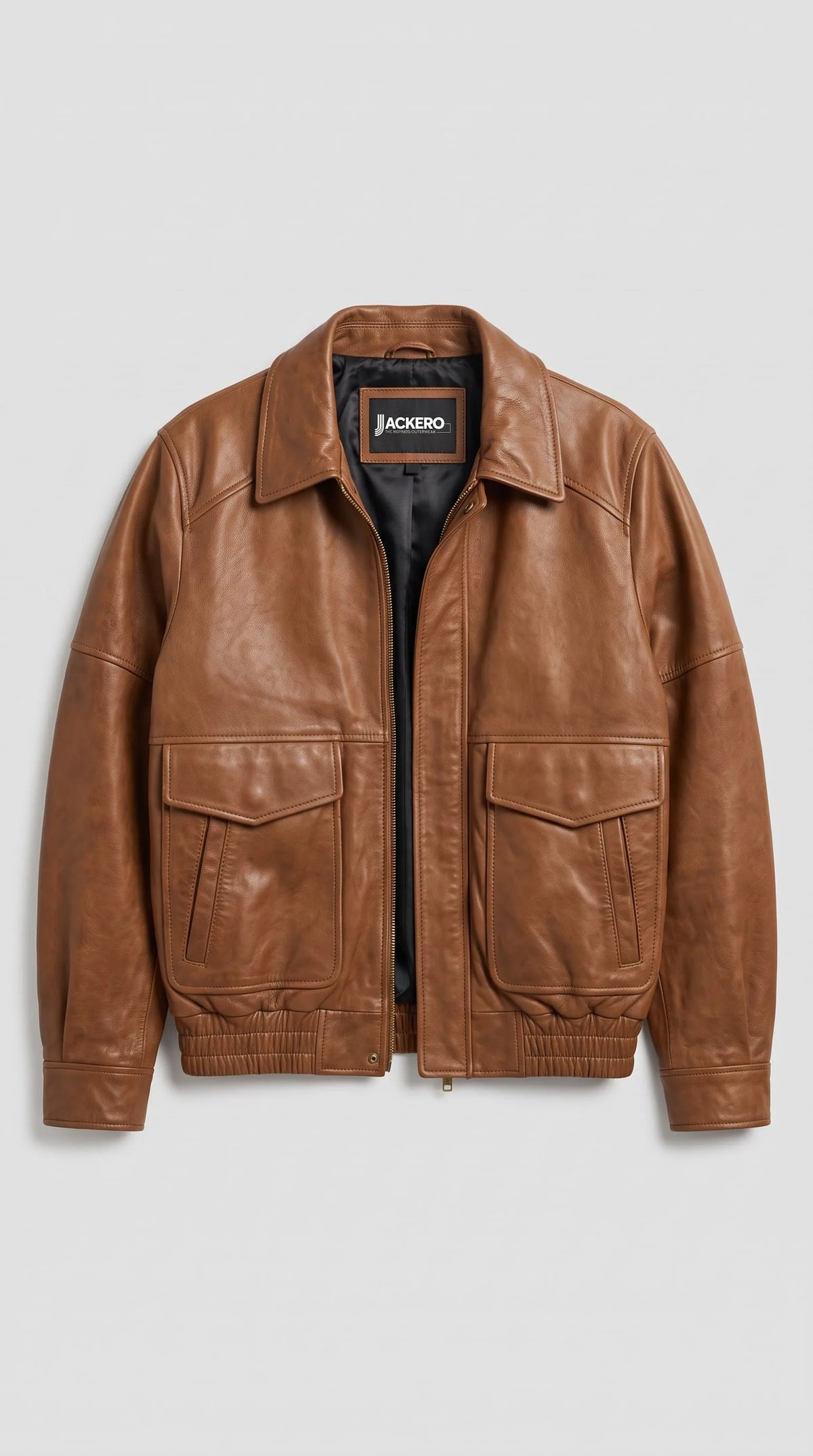 Premium brown leather jacket for women, handcrafted soft cowhide with warm caramel tone, gold zip front, utility flap pockets and cropped bomber fit, perfect gift idea and wardrobe essential