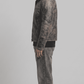 Heavy-duty dark grey leather bomber jacket with insulated white shearling collar for winter weather.