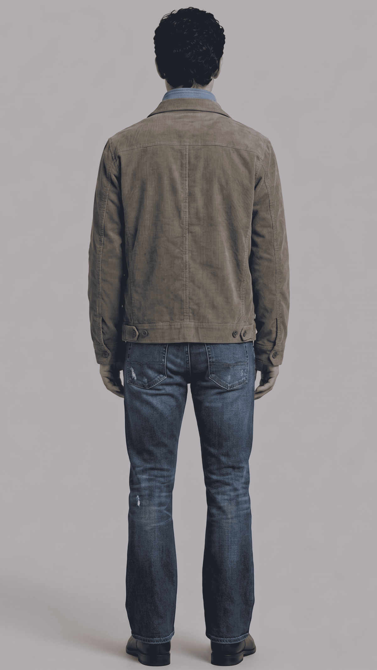Tailored fit dark grey utility suede outerwear layered over a casual sweater for a modern rugged aesthetic.