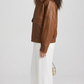 JACKERO Cognac brown real leather bomber jacket with a classical shirt collar, elasticated waist hem, and snap cuffs.