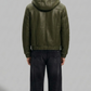 Jackero men's dark green hooded leather bomber highlighting clean seam alignment and structured fit.