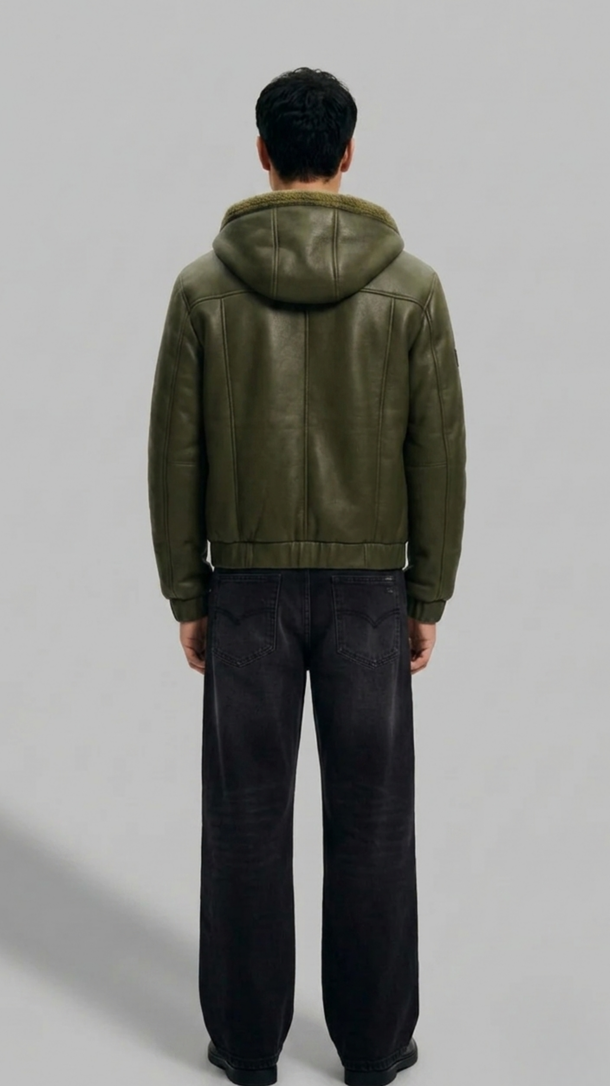 Jackero men's dark green hooded leather bomber highlighting clean seam alignment and structured fit.