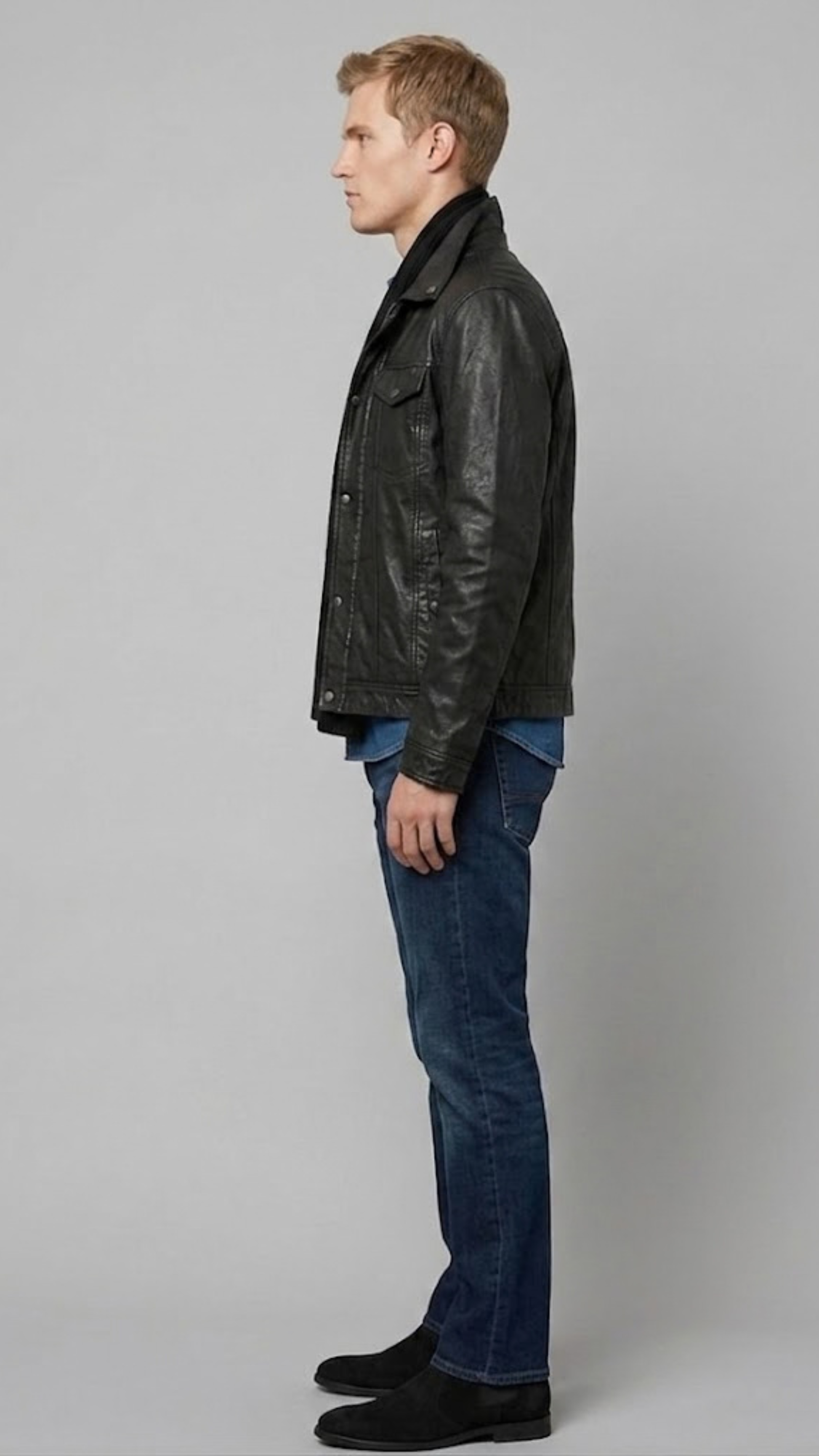 Contemporary lifestyle streetwear look presenting a sleek black leather button-up jacket with functional flap pockets.