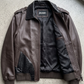 Jackero dark brown leather and black crocodile textured jacket displayed against a clean studio backdrop.