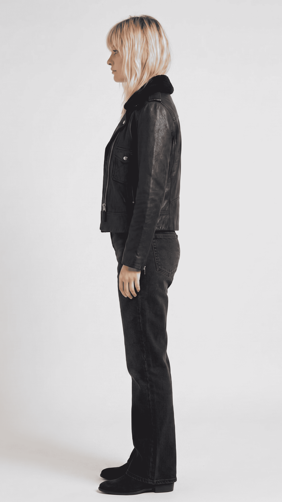 a model wearing a high-end premium black leather motorcycle jacket for an elite streetwear style.